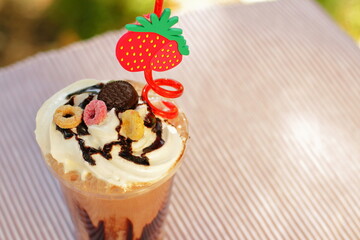 Chocolate and milk shake with cream and cookies