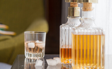 Luxury glass bottles with different alcoholic spirits inside, copy space photo