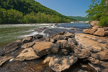 Fototapeta na wymiar Fast Moving Water on a Mountain River