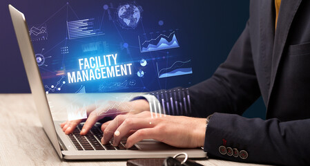 Businessman working on laptop, business concept