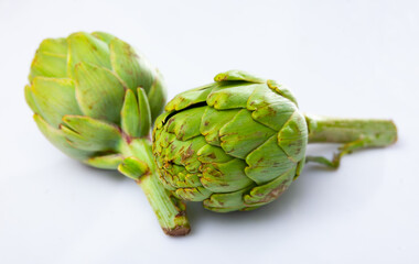 Fresh ripe artichokes on a white background. Ingredients for cooking