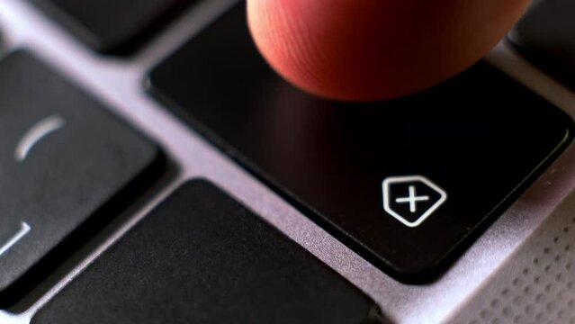 User presses backspace key to delete data on notebook keyboard extreme close view. Person works on computer. Technology advantages