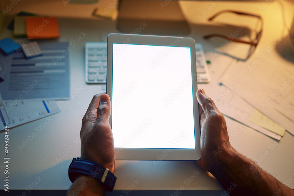 Poster Shining a light on business. Cropped shot of an unrecognizable man using a digital tablet during a late night at work.