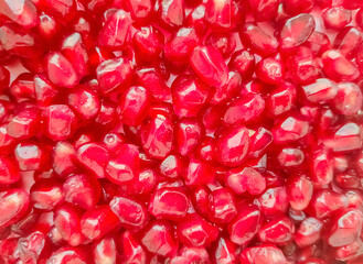 Fresh pomegranate seeds fruit background. Healthy food 