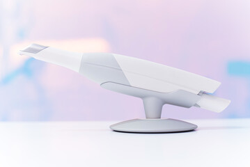 Dental intraoral scanner isolated on table in bright dentist office. Dentistry and health care concept. Close up.