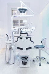 Modern Dental Clinic. Comfortable dentist chair. Dental equipment and accessories.