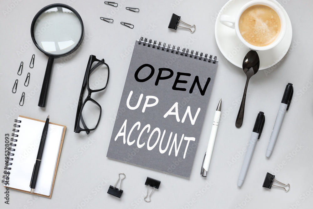 Poster text on a gray notebook on a gray background open up an account