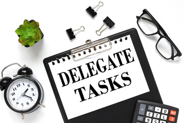 Delegate Tasks white paper text on black folder