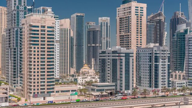 Dubai Marina skyline with Mohammad Bin Ahmed Al Mulla mosque aerial timelapse
