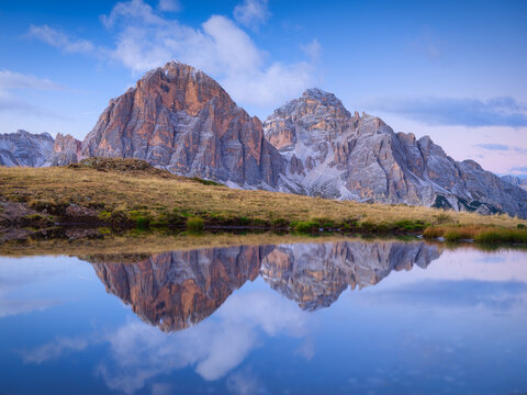 High mountains and reflection on the surface of the lake. Giau Pass, Dolomite Alps, Italy. Landscape in the highlands during sunset. Photo in high resolution. © biletskiyevgeniy.com