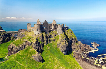 Dunluce Castle, mediaeval ruin between Portrush and Bushmills on North Antrim Coast Road, County...