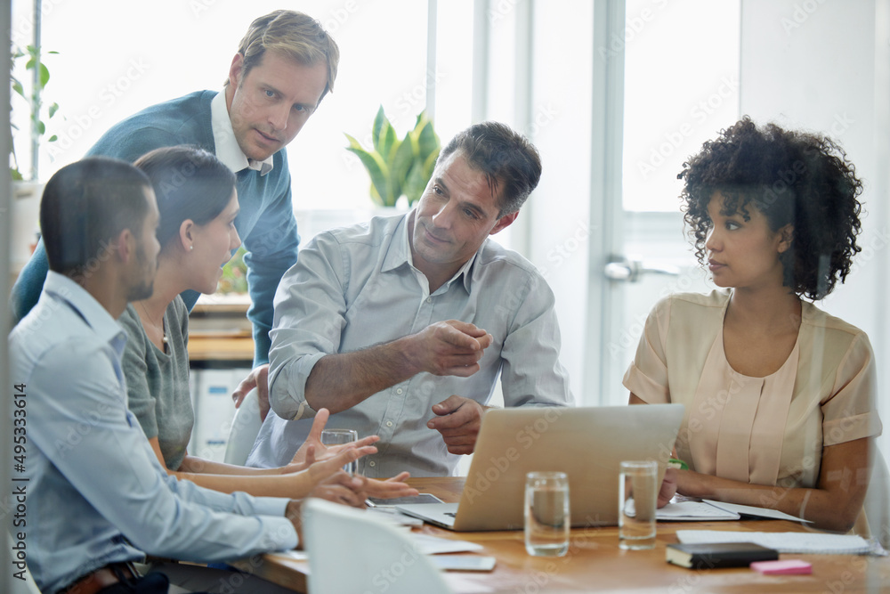 Aufkleber technology brings their ideas to life. shot of a group of professionals using wireless technology du