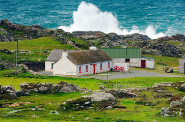 Atlantic storm waves beat the coast near Malin Head on the Inishowen Peninsula, County Donegal. Northernmost tip of Ireland. - obrazy, fototapety, plakaty