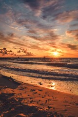 Beautiful summer holiday landscape. Sunset on a sandy beach by the Polish sea.