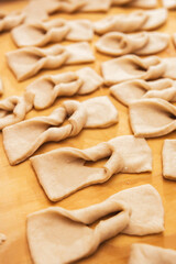 Dough on a wooden table. Chilean fried pastries. Latin food.