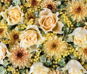 Yellow roses and mimosa flower arrangement