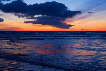 Fototapeta na wymiar Nature turning up its sensuality. Shot of a beautiful sunset over the beach.