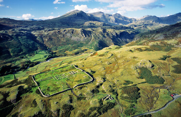 Hardknott Roman Fort Mediobogdum with Scafell mountain behind above Eskdale in Lake District...