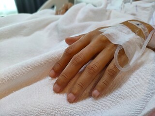 hand with saline hose