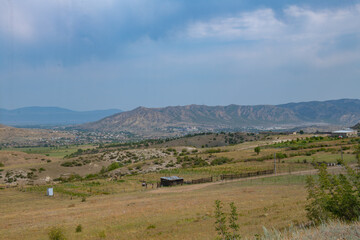 Fototapeta premium picturesque fields and mountains in georgia in summer