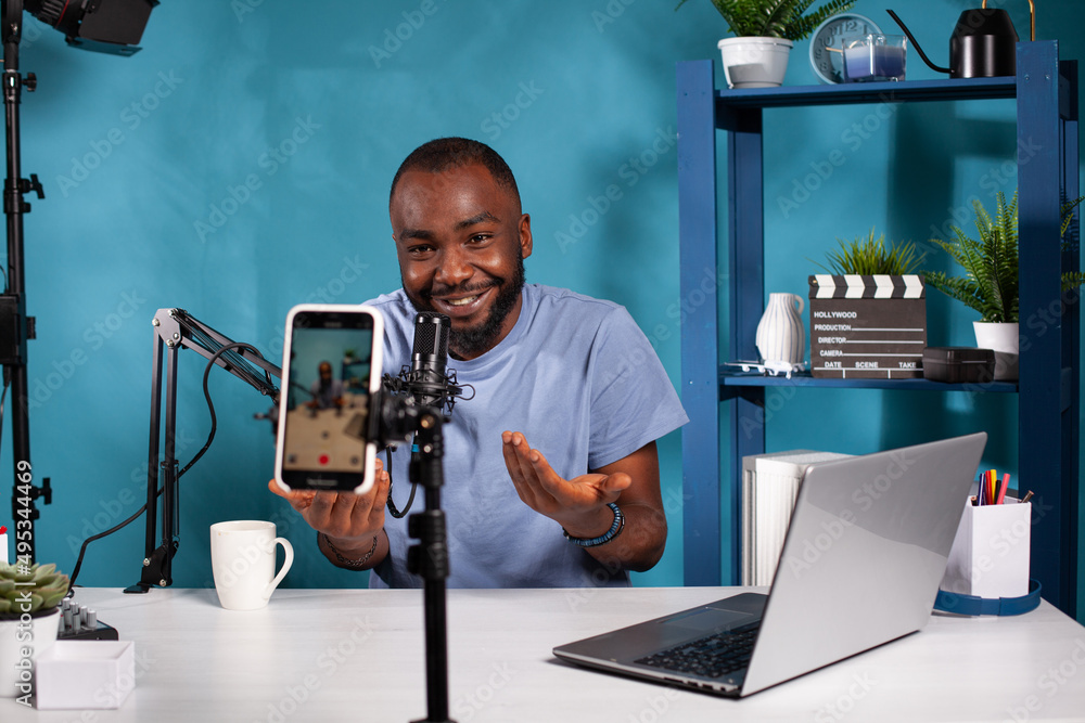Poster content creator interacting with fans looking at live video podcast setup moving hands gesturing. in