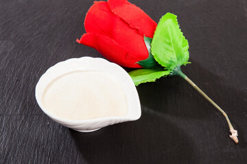 Collagen powder, on black background.