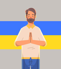 man patriot with Ukrainian flag asking for help pray for Ukraine peace save Ukraine from russia stop war concept