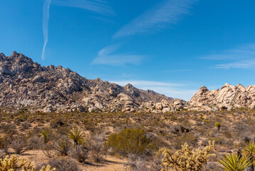 Stunning blue sky in the Mojave Desert of California Nevada with rock boulders covering the dry, arid climate