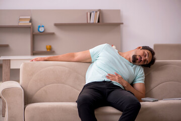 Young man sitting on the sofa