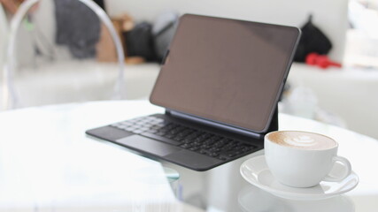 coffee cup latte art with laptop