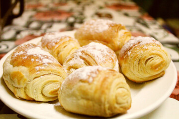 sweet bun, muffin on a plate cooked at home 