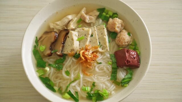 Vietnamese Rice Noodles Soup with Vietnamese Sausage served vegetables and crispy onion - Asian food style