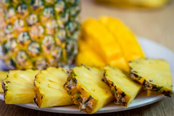 Vietnamese asia fruits: pineaple, banana, dragon fruit, mango. Fresh, jucie and very tasty.