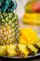 Vietnamese asia fruits: pineaple, banana, dragon fruit, mango. Fresh, jucie and very tasty.