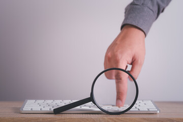 magnifying glass with computer keyboard to Searching for information. Using Search Console with...