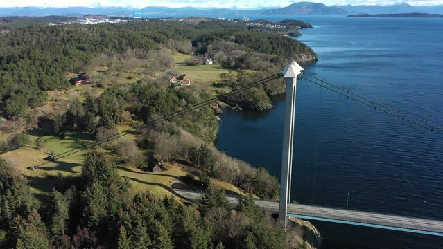 Tower of Bomlo suspension bridge before revealing full bridge view and Spissousundet fjord