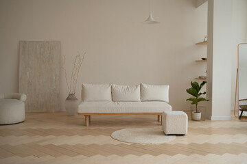 Beautiful Scandinavian-style interior, natural materials, wooden floor and fabric-covered sofa.