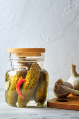 Pickled cucumbers in a jar.