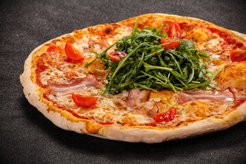 Pizza with bacon and rucola