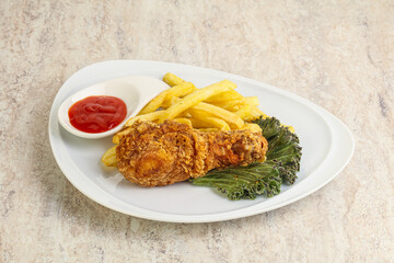 Crispy chicken leg with fry potato