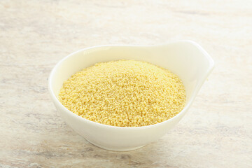 Raw couscous in the bowl