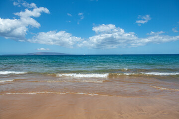Fototapeta na wymiar Beach background. Calm beautiful ocean wave on sandy beach. Sea view from tropical sea beach.