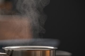 Fototapeta na wymiar Saicepan with hot boiling water closeup
