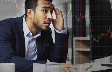 I cant believe what just happened. Shot of a young man looking shocked at stock market figures.