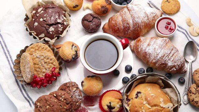 Variety of delicious confectionery products. Top view, rotation. Sweet desserts 