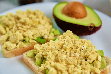 Toasts with avocado and egg on white plate, Healthy food and dieting concept, Organic product