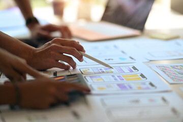 Close up view creative people  planning application process development prototype wireframe for web...