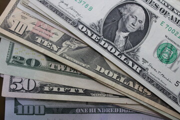 US dollar bills arranged in order of value