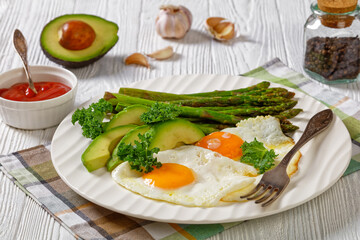 roast asparagus, ripe avocado and fried eggs