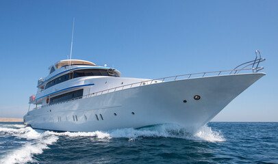 Luxury private motor yacht sailing at sea